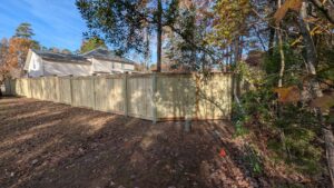 A long section of newly installed wooden privacy fence by Gifford Contracting & Repair - Custom Privacy Fencing in Goose Creek, SC.