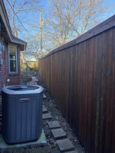 A newly installed wooden privacy fence along a residential property by Stevenson Brothers Fencing in Fort Worth, TX