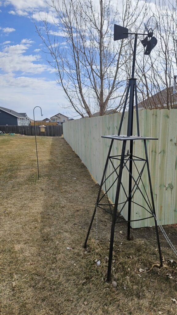 A newly installed wooden privacy fence in a residential yard, demonstrating quality work by Row Fencing and Services in Williston, ND.