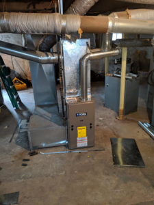A new York furnace and ductwork installation in a basement by A&T Mechanical in Edmond, OK