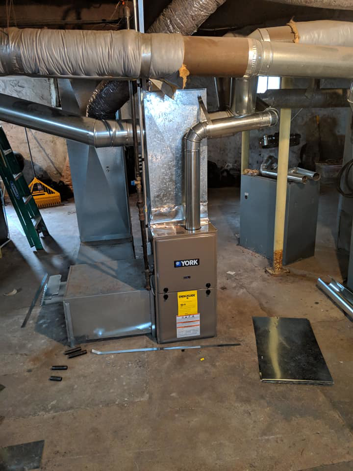 A new York furnace and ductwork installation in a basement by A&T Mechanical in Edmond, OK