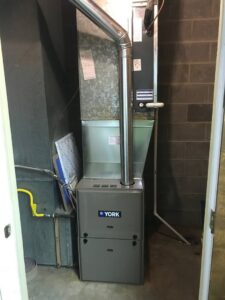 A newly installed York brand furnace and air handler unit by Montefusco HVAC in Peoria, IL