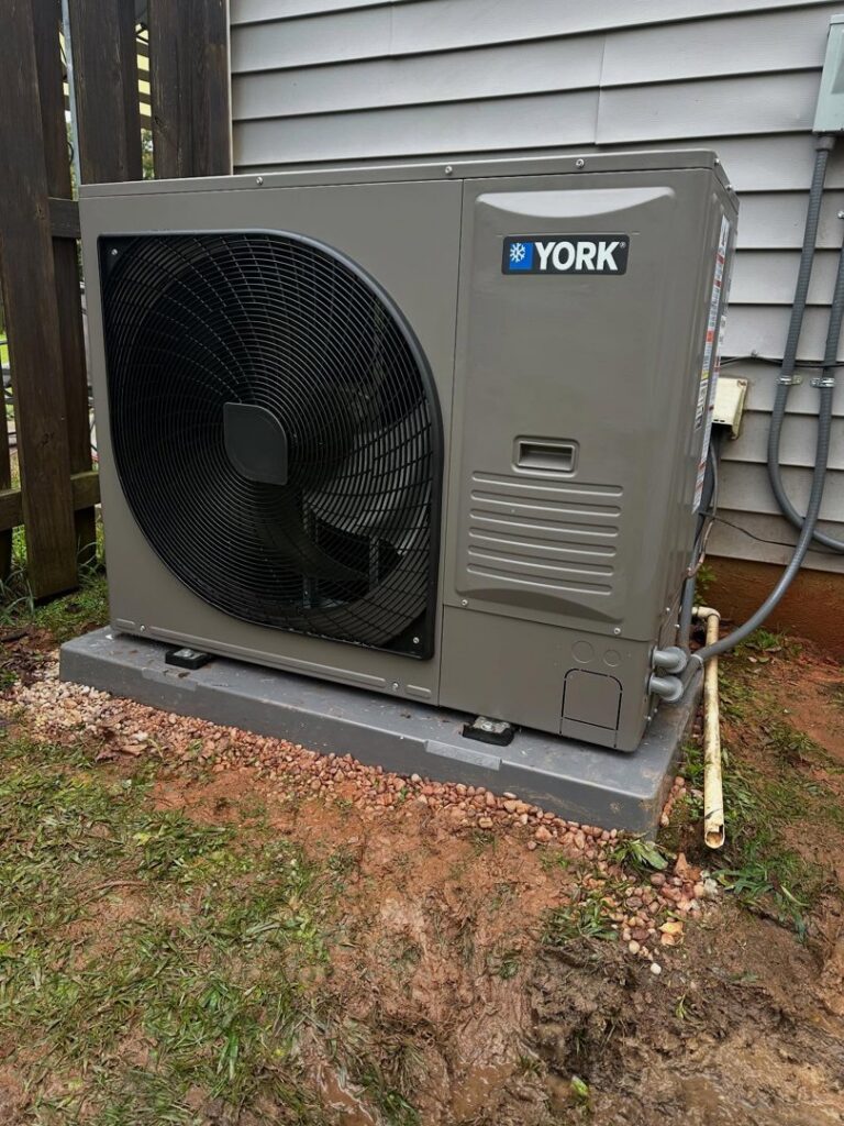 A newly installed York outdoor HVAC unit by Pappy's Heating & Air INC, providing reliable heating and air in Clayton, NC.
