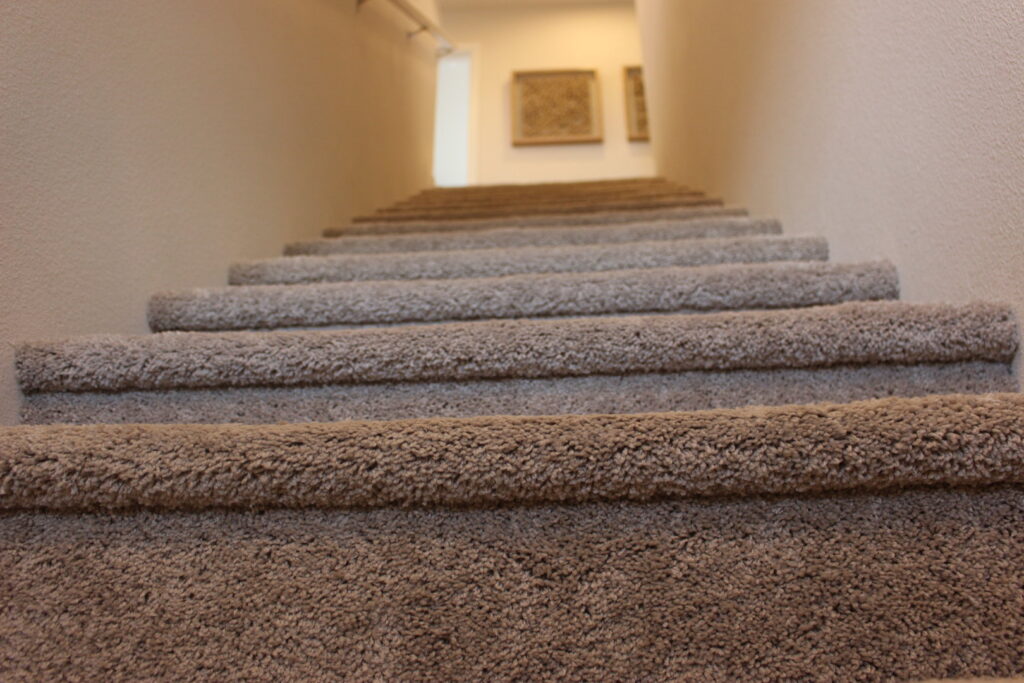 A newly installed carpet on a residential staircase by Flourish contractors in Salem, OR.