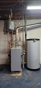 A newly installed boiler and water heater system by Huether Heating & Cooling Inc in a Rochester, NY home.