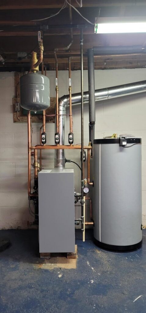 A newly installed boiler and water heater system by Huether Heating & Cooling Inc in a Rochester, NY home.