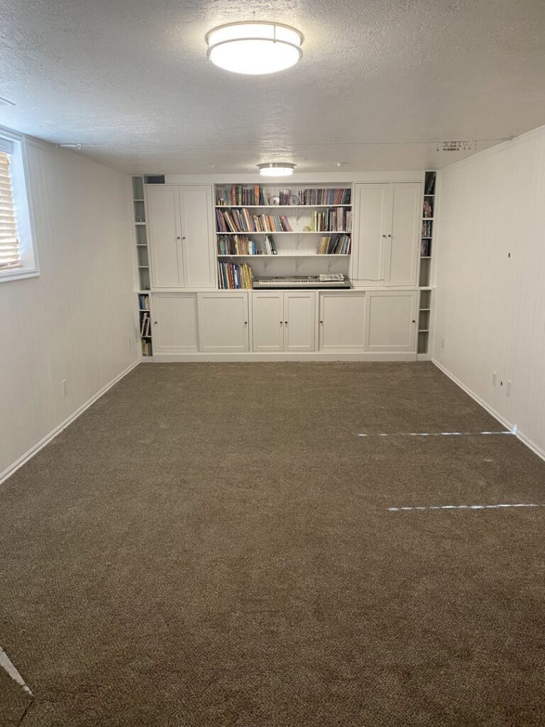 A room featuring newly installed brown carpet by Taylor Carpets & Flooring in Provo, UT