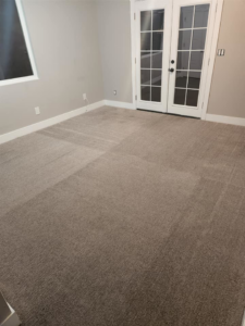 A spacious bedroom featuring newly installed or professionally cleaned carpet by Clean Freaks in Ogden, UT.