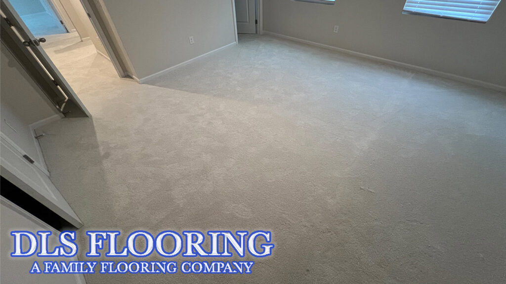 A bright, newly installed light-colored carpet in a residential room by DLS Flooring in Akron, OH.