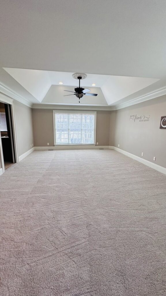 A spacious bedroom featuring newly installed light-colored carpet by Ordonez Flooring and Installation in Lewis Center, OH.