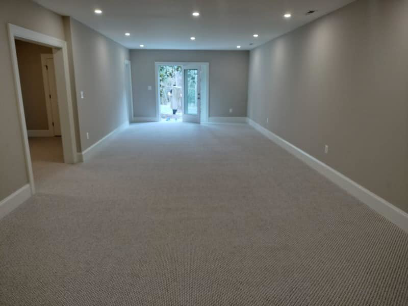 Newly installed light-colored carpet in a spacious room by Amazonia Floors in bel air, Baldwin, MD.