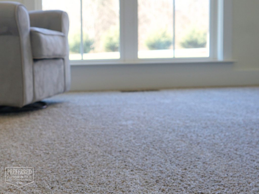 Newly installed light brown carpet in a residential room by Preferred Floor & Tile CO. in Charlotte, NC