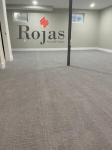 A room with newly installed light gray carpet, showcasing a professional carpet installation by Rojas Carpet and Flooring in Denver, CO.