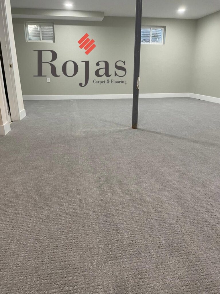 A room with newly installed light gray carpet, showcasing a professional carpet installation by Rojas Carpet and Flooring in Denver, CO.