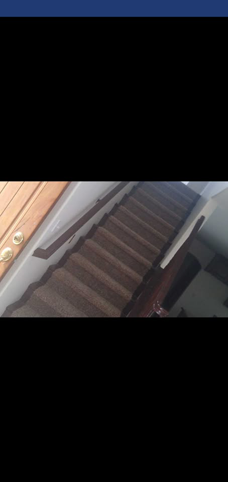 A newly installed carpet on a residential staircase by The Carpet Plaza in Bakersfield, CA