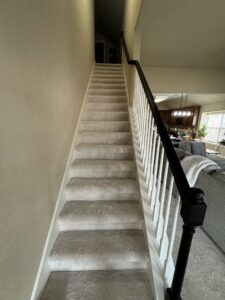 A newly installed carpeted staircase by Trendsetters Flooring in Benbrook, TX