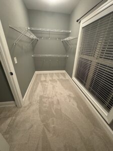 Newly installed light gray carpet in a walk-in closet by Legacy Flooring Co. in Murfreesboro, TN.