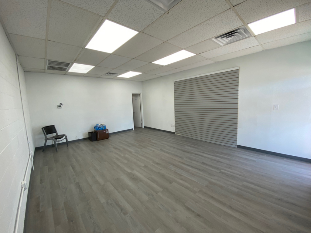 Newly installed bright LED ceiling lights in a renovated commercial space by Redbud Current Co., LLC in Tulsa, OK.