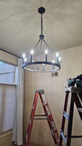 A newly installed modern chandelier by V Electrical LLC, ready to illuminate a room in Albuquerque, NM.