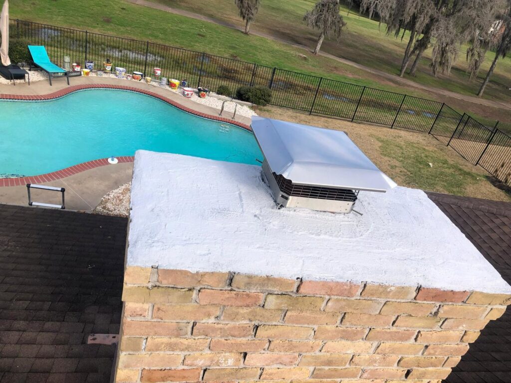 A newly installed metal chimney cap on a brick chimney by Royal Chimney Sweep AZ in Phoenix, AZ.