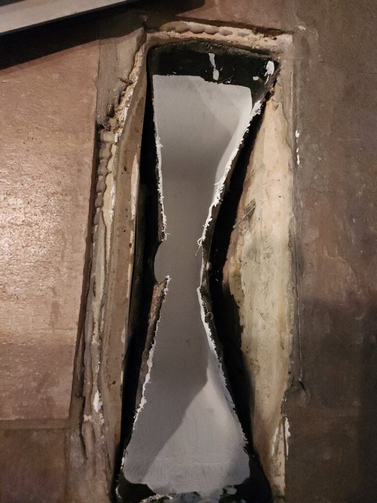 A newly installed or repaired duct lining, showing a clean, white interior within a duct opening by Air Doctor Duct Cleaning & Lining in Tulsa, OK.