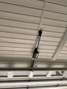 A newly installed garage door opener on the ceiling by Specialty Garage Door in Bossier City, LA