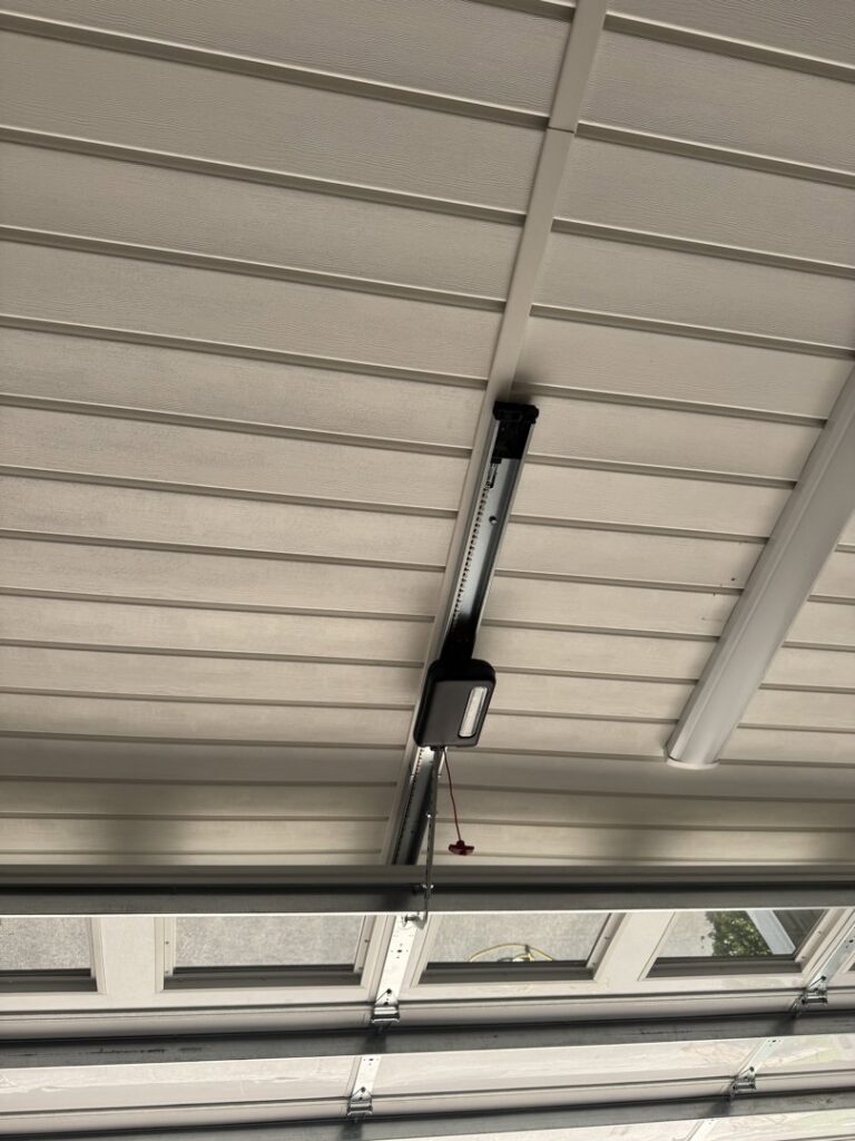 A newly installed garage door opener on the ceiling by Specialty Garage Door in Bossier City, LA
