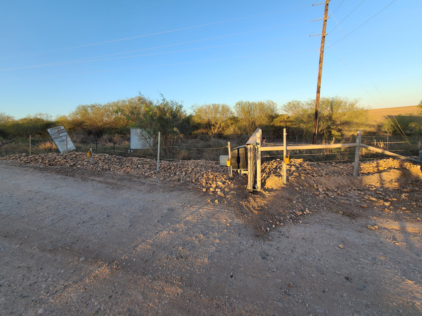 A newly installed gate and fence line in a rural setting by S.A. SAF-T Systems, LLC in San Antonio, TX.
