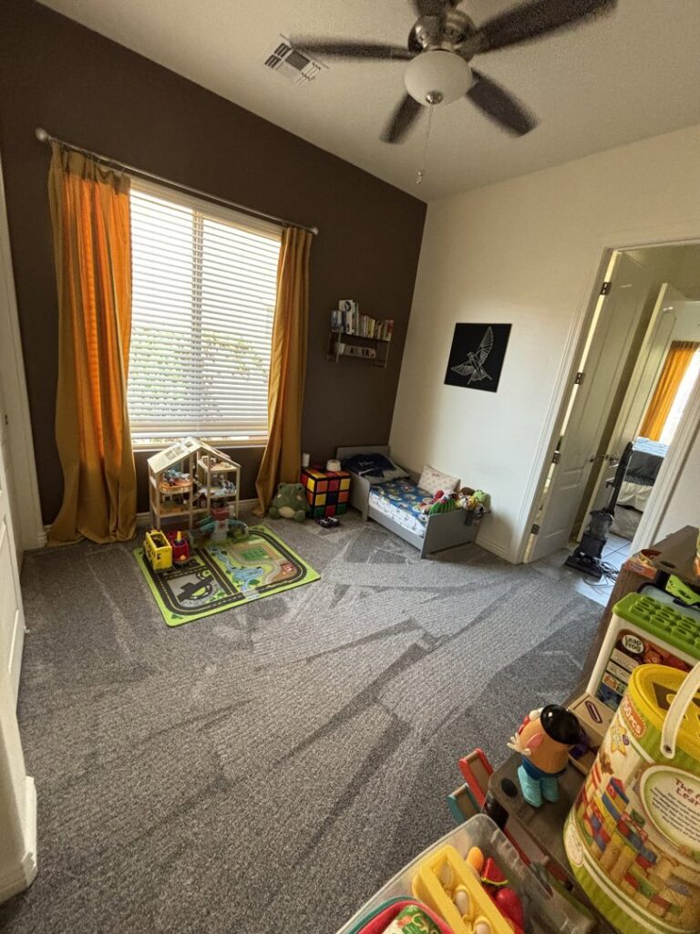 A child's bedroom featuring newly installed gray carpet by Vision Flooring in Chandler, AZ.