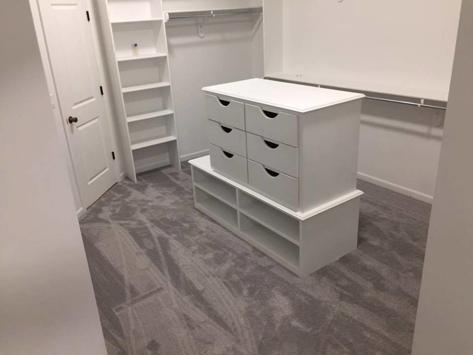 A spacious closet with newly installed light gray carpet by All Dimension Floor Care in Lenexa, KS.