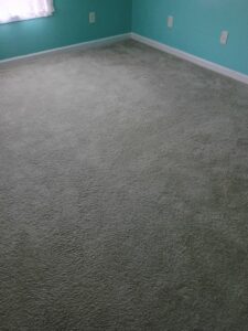 Newly installed gray carpet in a residential room by Wholesale Carpet of Sumter in Sumter, SC.