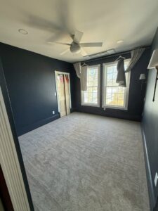 A newly installed light grey carpet in a bedroom by Concord Carpet Center LLC in Concord, NH