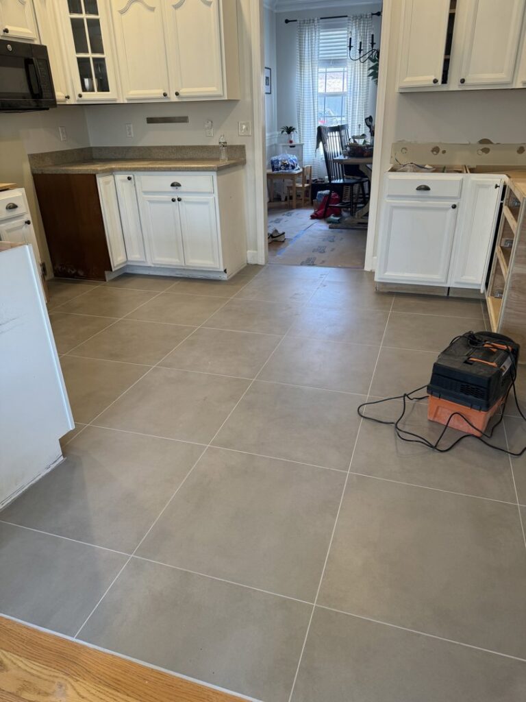 A bedroom featuring newly installed plush grey carpet by Dalton Wholesale in Adairsville, GA.