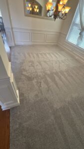 A newly installed grey carpet with visible nap patterns in a residential room by Davis Elite Flooring in Norcross, GA.