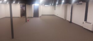 A spacious room featuring newly installed grey carpet by Red carpet&home remodeling, a trusted carpet contractor in Olney, MD.