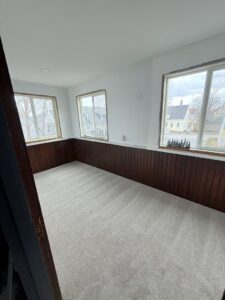 A newly installed light grey carpet in a room by Concord Carpet Center LLC in Concord, NH