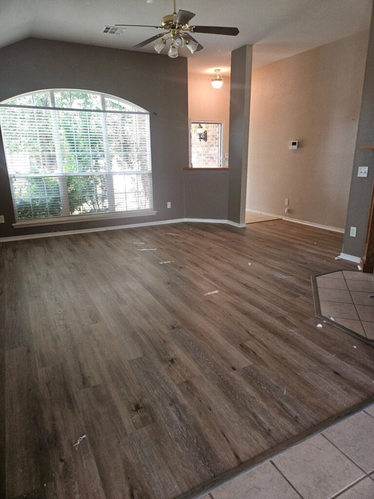 A room featuring a newly installed grey carpet by Floor Coverings International Metro OKC in Moore, OK.