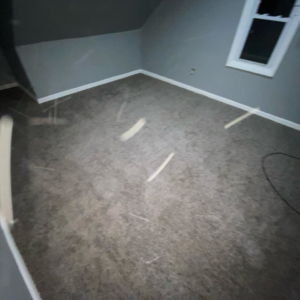 A room featuring newly installed grey carpet, showcasing a completed project by HK Carpet Doctors in Sterling Heights, MI
