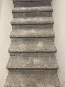 Newly installed grey carpet on a staircase by Columbia Flooring Group in Troutdale, OR