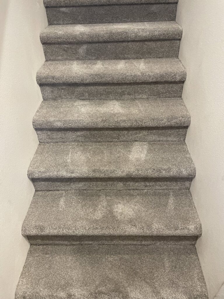 Newly installed grey carpet on a staircase by Columbia Flooring Group in Troutdale, OR