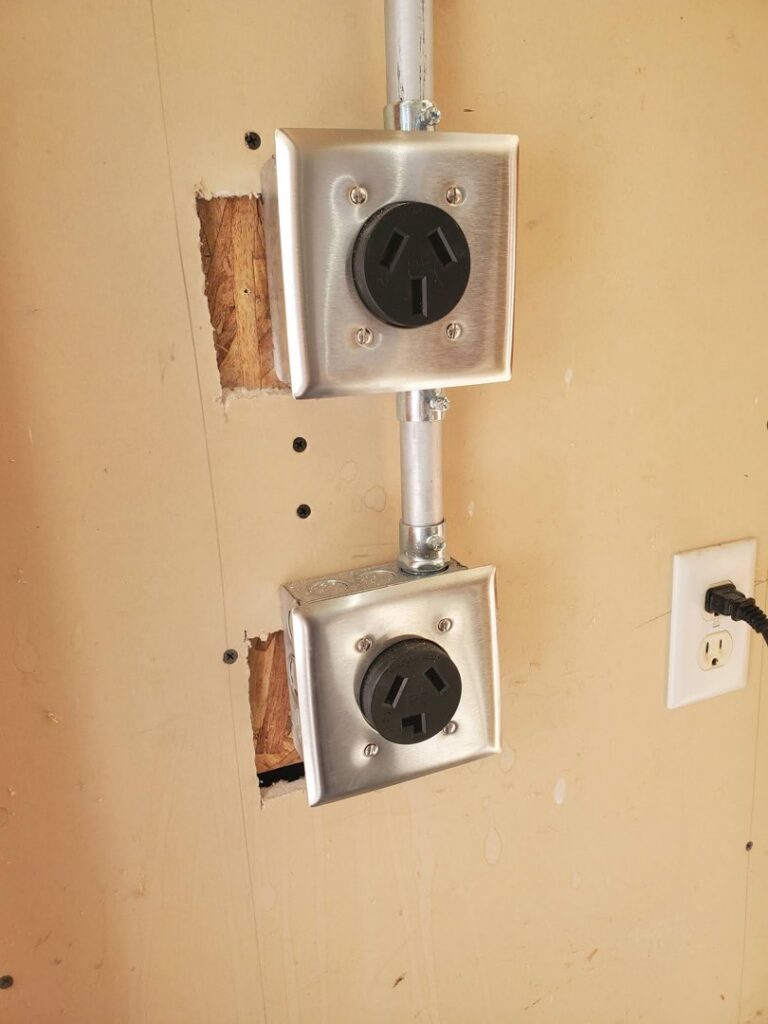 Newly installed heavy-duty electrical outlets with conduit on a wall by Wheeler Electric, Inc. in Idaho Falls, ID.