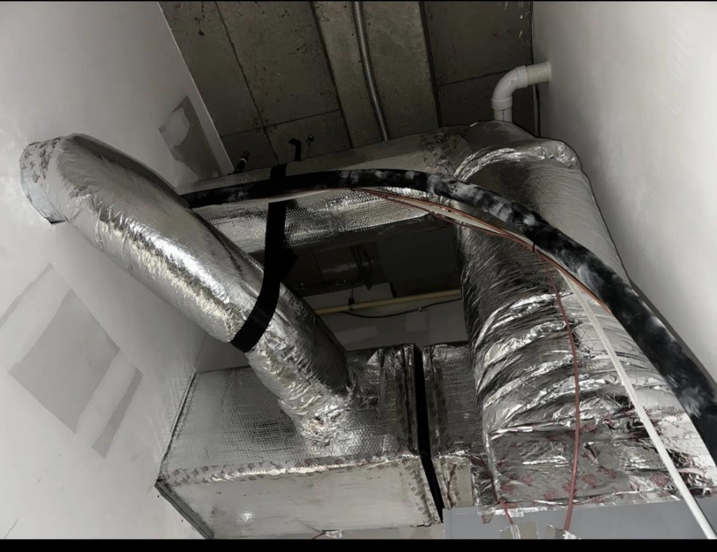 Newly installed insulated HVAC ductwork in a commercial building by Air Conditioning Experts in Orlando, FL.