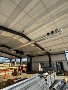 Newly installed insulated HVAC ductwork visible in a commercial building by Delta Heating, Cooling, Plumbing in Wilson, NC.