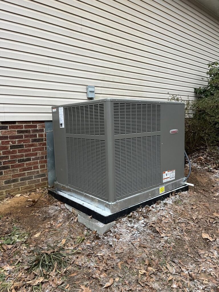 A newly installed outdoor HVAC unit next to a residential building by Parks Heating Cooling Plumbing & Electrical in Indian Trail, NC