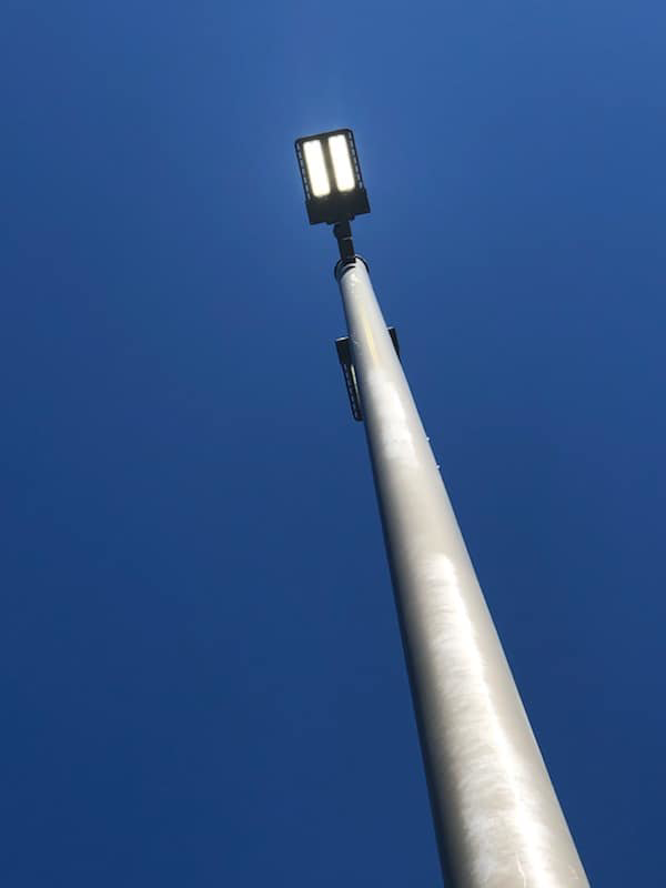 A bright, newly installed LED street light against a clear blue sky, showcasing work by Rylix Electric in Cincinnati, OH.