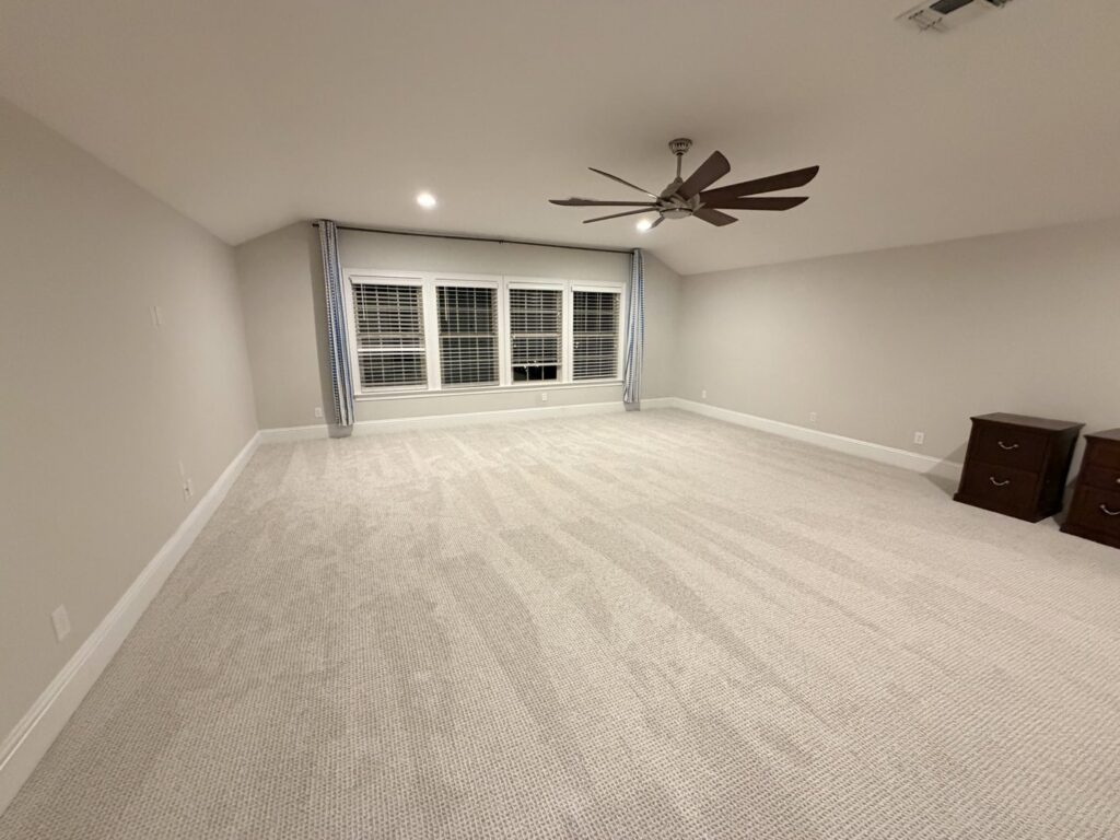 A spacious room featuring newly installed light-colored carpet by Empire Today in Orlando, FL