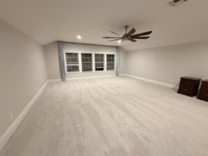 A spacious room featuring newly installed light-colored carpet by Empire Today in Orlando, FL