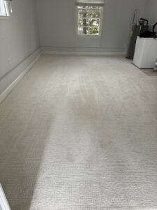 A newly installed light-colored wall-to-wall carpet in a room by L & L Flooring and Design in Nashville, TN.
