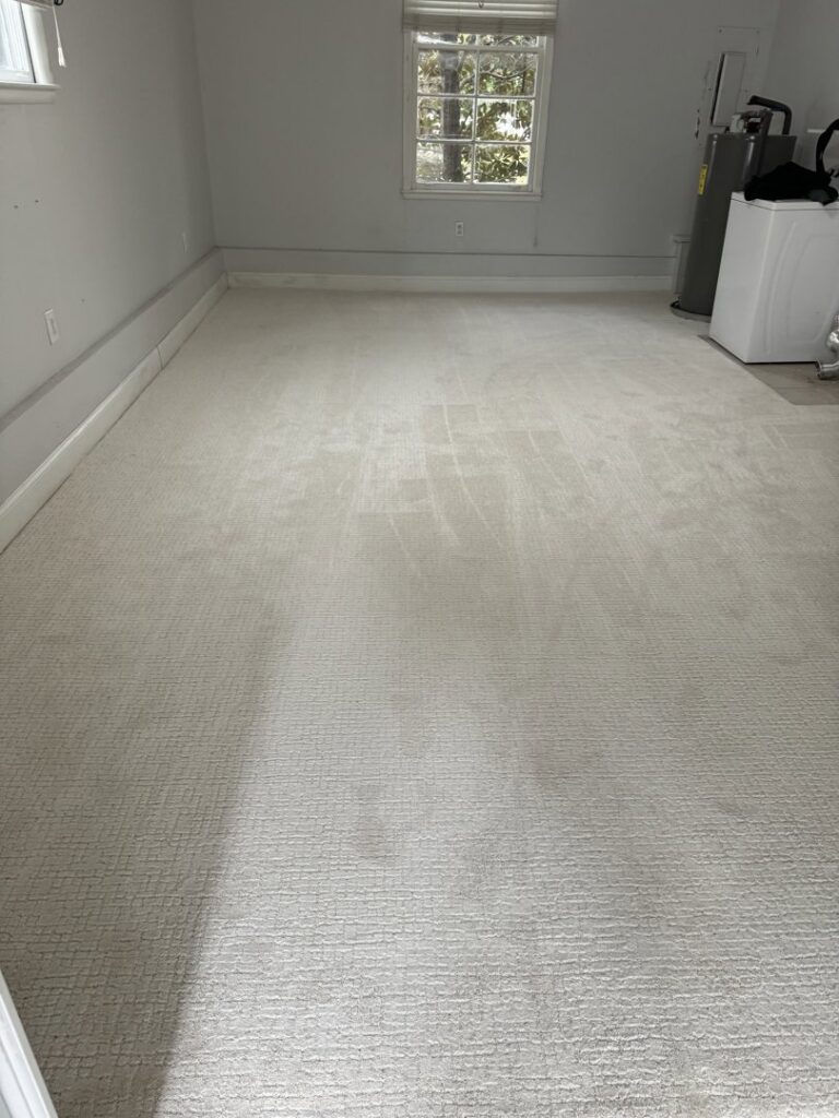 A newly installed light-colored wall-to-wall carpet in a room by L & L Flooring and Design in Nashville, TN.