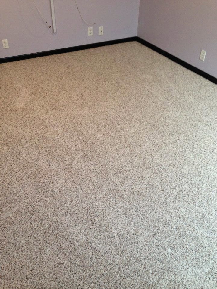 A room featuring newly installed light-colored carpet by Wall To Wall Carpet One Floor & Home in Eau Claire, WI